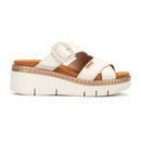 White sandal with brown sole on a white background