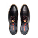 Pair of black leather shoes with visible brand name on a white background