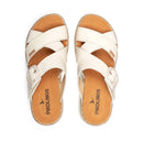 Pair of white sandals with tan soles on a white background