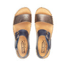 Pair of sandals with metallic band and wooden sole on a white background