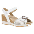 White wedge sandal with cork sole on a white background