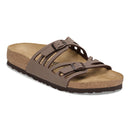 Brown sandal with cork sole on a white background