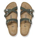 Pair of green Birkenstock sandals on a white background