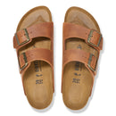 Pair of brown Birkenstock sandals on a white background