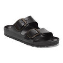 Black sandal with two straps on a white background