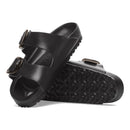 Black sandals with buckle design on a white background