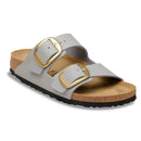 Gray sandal with gold buckles on a white background