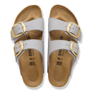 Pair of gray sandals with gold buckles on a white background