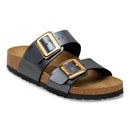 Birkenstock sandal with gold buckle on a white background