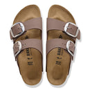 Pair of brown Birkenstock sandals with buckles on a white background