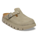 Beige clog shoe with a buckle on a white background