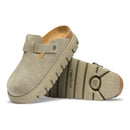 Beige clogs with cork insole on a white background