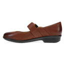 Brown leather shoe with a strap on a white background