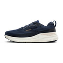 Navy running shoe with white sole on a white background