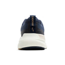 Navy running shoe with white sole on a white background