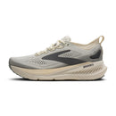 A Brooks running shoe in light gray and cream with dark gray accents, shown from the side against a plain white background.