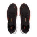 Black running shoes with orange accents on a white background