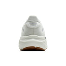 White sneaker with brown sole on a white background