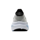 Back view of a gray and black running shoe on a white background