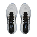 Pair of white running shoes with black soles on a white background