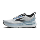 White running shoe with black and blue accents on a white background