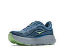 Blue running shoe with green sole on a white background