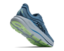 Blue running shoe with green sole on a white background