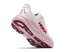 White running shoe with pink sole on a white background