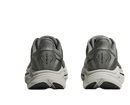 Pair of gray running shoes with white soles on a white background