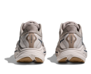 Pair of beige running shoes on a white background