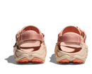 Pair of beige and pink sandals on a white background