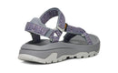 Gray sandal with purple floral straps on a white background