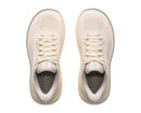 Pair of beige running shoes on a white background
