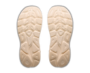 Beige shoe insoles with tread pattern on a white background