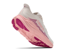 Pink and white sneaker with visible brand logo on a white background