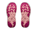 Pink and beige shoe sole with textured pattern on a white background