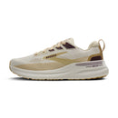 Beige and white running shoe with 'Brooks' branding on a white background
