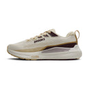 Beige running shoe with 'Brooks' branding on a white background