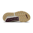Close-up of a shoe sole with a brand logo on a white background