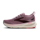 Purple running shoe with white sole on a white background