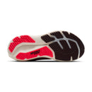 Close-up of a running shoe sole with red and black design on a white background