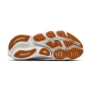 Sole of a running shoe with brown tread pattern on a white background