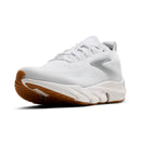 White athletic shoe with brown sole on a white background