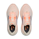Pair of pink running shoes with orange accents on a white background