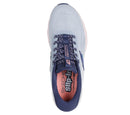 Blue sneaker with pink sole on a white background