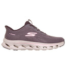 A Skechers running shoe in a muted purple-gray colorway with a light pink S logo and white cushioned sole, shown from a side profile on a white background.