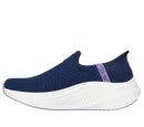 Navy blue athletic shoe with a white sole on a white background