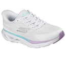White running shoe with purple sole on a white background