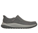 Gray slip-on shoe with 'Goodyear' branding on a white background