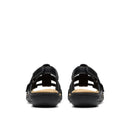 Black sandals with tan soles on a white background